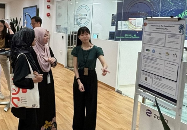  ​SGH Executive and RPA Citizen Developer Emelyne Khoo (extreme right) sharing how the bot she developed
and deployed helped with automating operational workflow.  
Photo credit Artificial Intelligence & Automation, Future Health
System, Singapore General Hospital 