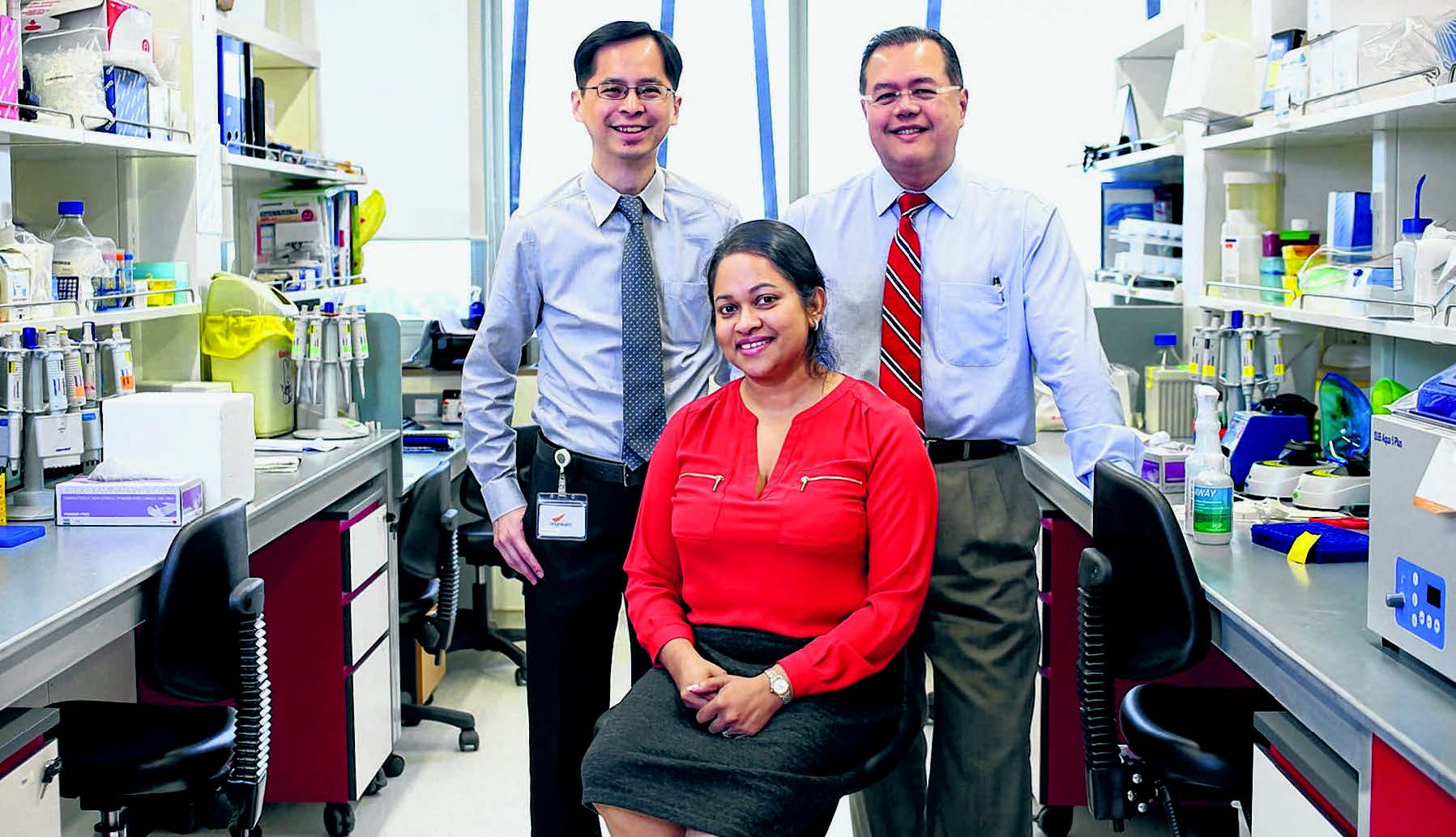  and Professor Aung Tin and their team discovered four genes linked to intraocular pressure and glaucoma risk. Associate Professor Eranga Vithana (seated) was part of a team who found two new genes linked to primary open-angle glaucoma risk among the Chinese. ST PHOTO ONG WEE JIN