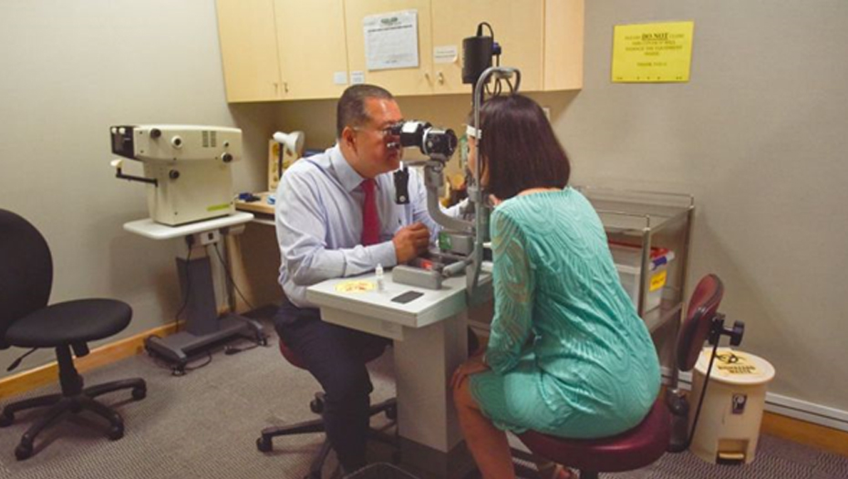  ​Professor Aung Tin, Singapore Eye Research Institute's executive director, conducting a mock eye examination. While overseas studies have found a link between myopia and glaucoma, it is the first time this link has been found in Singapore.ST PHOTO JASMINE CHOONG